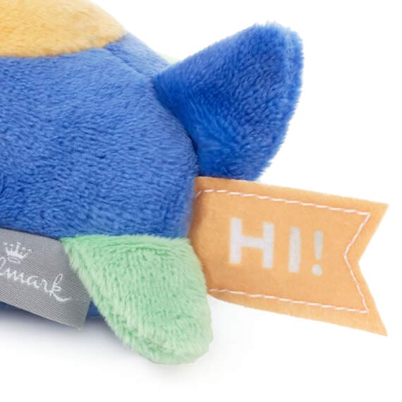 Blue and green stuffed airplane with a yellow propeller. It sits on a white background. Text on the airplane wing reads “H”. Hallmark Zip-Along Airplane Plush Toy.  pen_spark     tune  share   more_vert