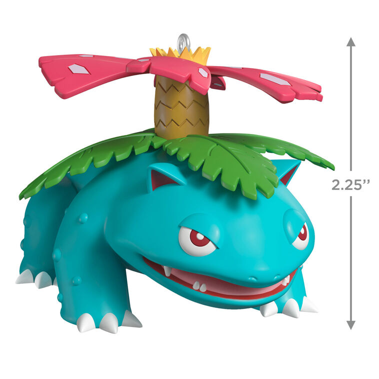 Hallmark Keepsake Pokémon Venusaur ornament with pink blossom on its back, blue-green body, red eyes, and festive Christmas style.