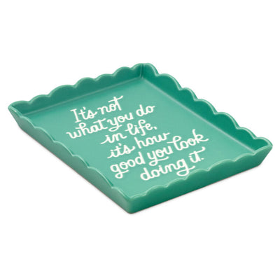 Teal Hallmark trinket tray with scalloped edge and message “It’s not what you do in life, it’s how good you look doing it.”