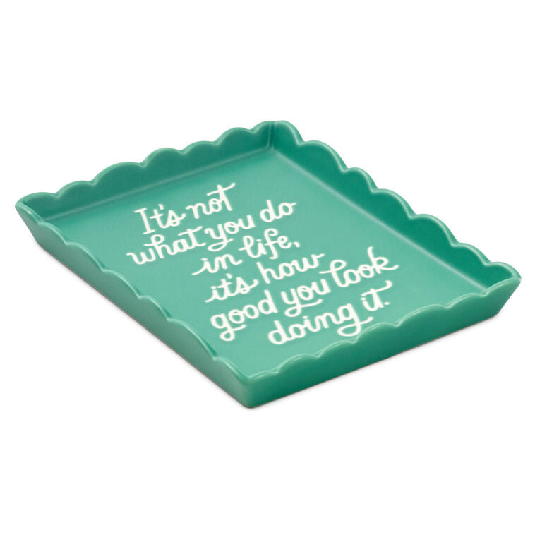Teal Hallmark trinket tray with scalloped edge and message “It’s not what you do in life, it’s how good you look doing it.”
