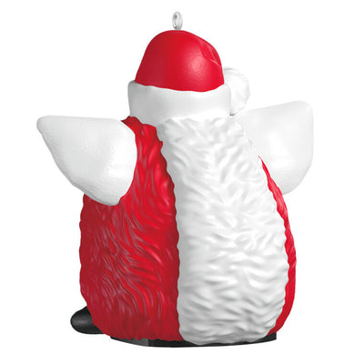 Festive Furby ornament, red and white electronic toy with blue eyes, yellow beak, Santa hat, Hallmark Keepsake, Christmas decoration.