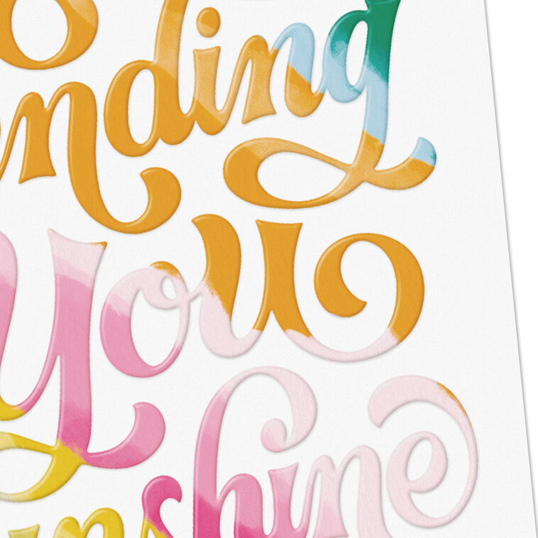 White blank note cards with colorful embossed “Sending You Sunshine” lettering in pink, orange, yellow, blue, and green.
