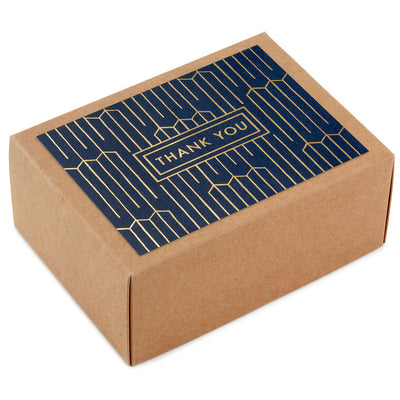 Navy blue thank-you cards with gold foil geometric lines and matching envelopes in kraft box.
