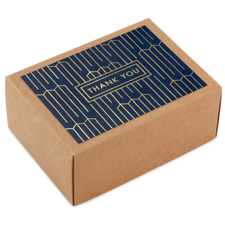 Navy blue thank-you cards with gold foil geometric lines and matching envelopes in kraft box.
