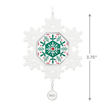 Elegant white porcelain snowflake ornament with red and green accents and red gemstone for 2025