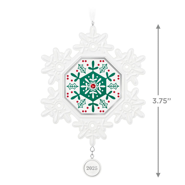Elegant white porcelain snowflake ornament with red and green accents and red gemstone for 2025