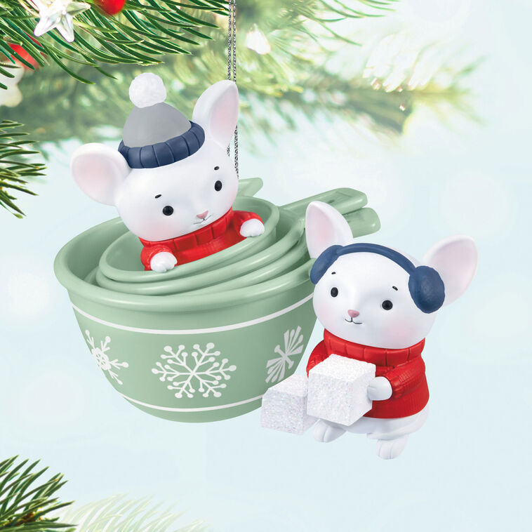 Christmas ornament with two mice in red sweaters and green measuring cups decorated with snowflakes, festive baking theme

