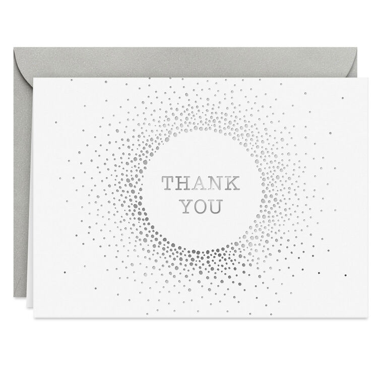 White thank-you cards with silver foil dots radiating from center text and matching envelopes.
