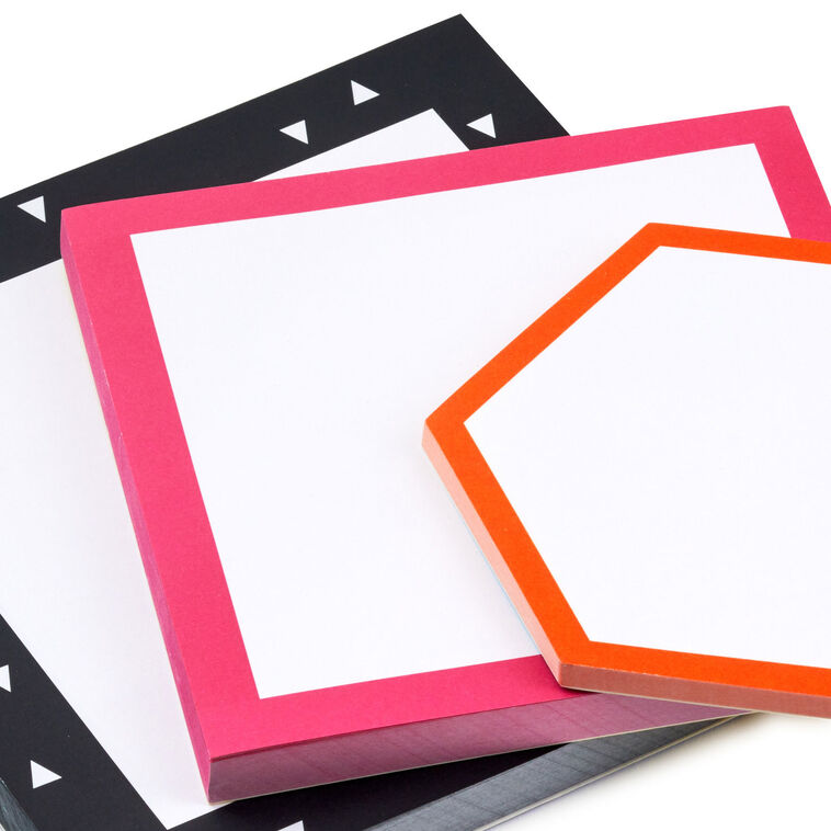 Set of three memo pads with pink, black, and orange borders in square and hexagonal shapes, arranged in a stack.

