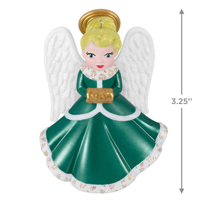 Hallmark Keepsake ornament of blonde angel in green and white dress with gold trim, glittery wings, and gold muff