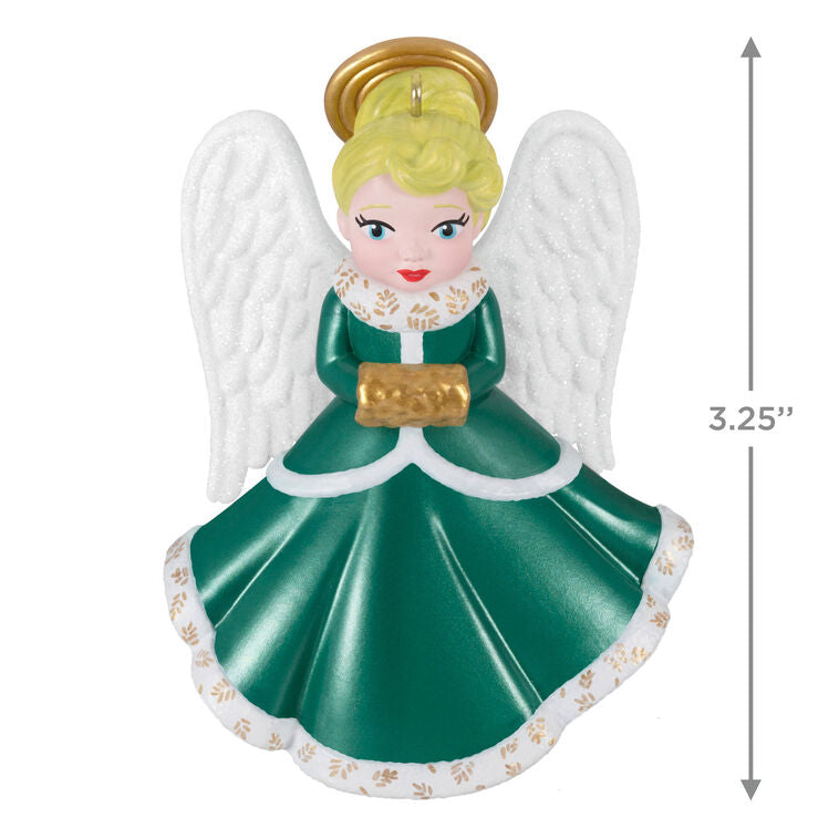 Hallmark Keepsake ornament of blonde angel in green and white dress with gold trim, glittery wings, and gold muff