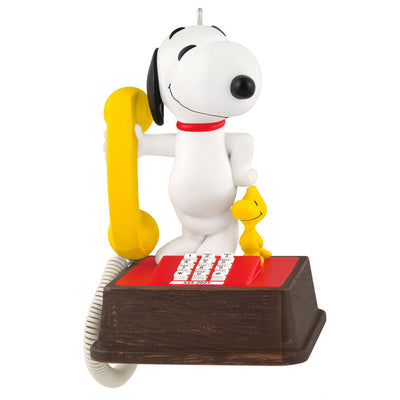 Snoopy on red and brown 1970s-style telephone with yellow receiver, Peanuts 75th anniversary Hallmark Christmas ornament with sound
