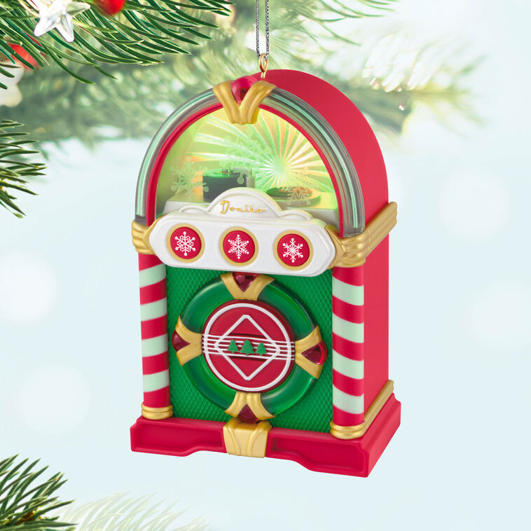 Retro jukebox Christmas ornament with lights and sound, plays three classic holiday tunes, battery operated

