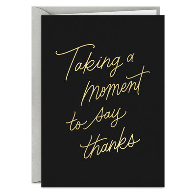 Black thank-you cards with elegant gold foil script reading “Taking a moment to say thanks.”
