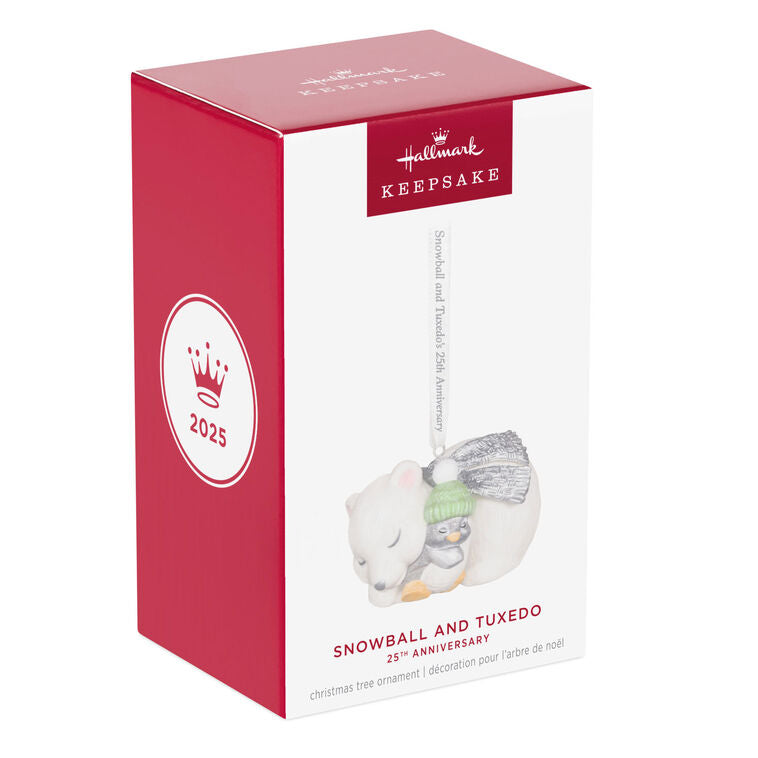 Hallmark Keepsake ornament of Snowball the polar bear cuddling Tuxedo the penguin, white and silver design celebrating 25th anniversary.