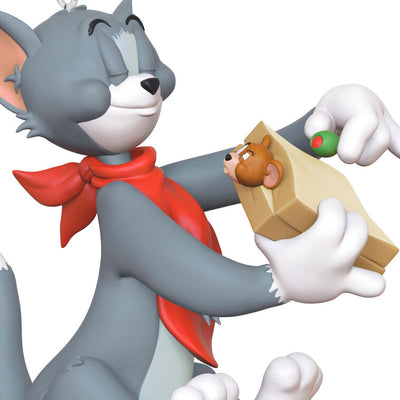Tom and Jerry Christmas ornament with Tom holding a sandwich and Jerry peeking out, red napkin around Tom's neck