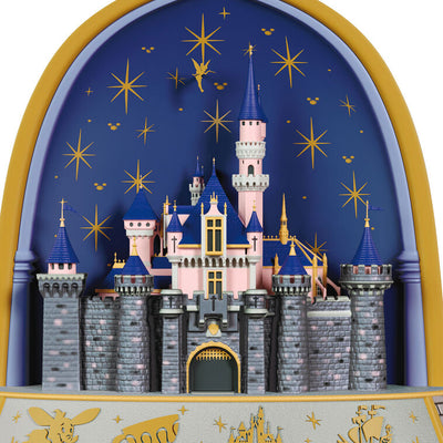 Disneyland 70th Anniversary ornament featuring Sleeping Beauty Castle, fireworks display, and shimmering lights in gold frame arch