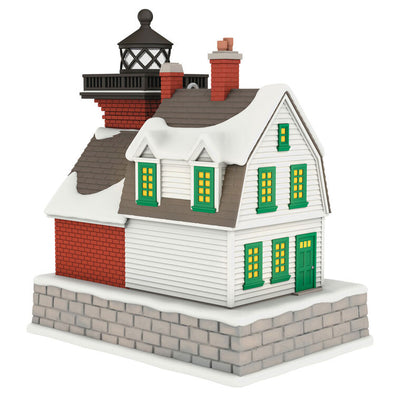 Hallmark Keepsake ornament of a brick lighthouse and home with Santa and polar bear, glowing windows and beacon, Holiday Lighthouse 2025