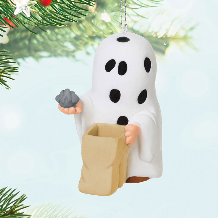 Miniature Charlie Brown Halloween ornament dressed as ghost holding rock from Peanuts Gang
