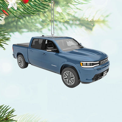 Blue Hallmark Keepsake metal ornament of 2026 Ram 1500 REV truck with detailed design, perfect for Christmas tree decorating.