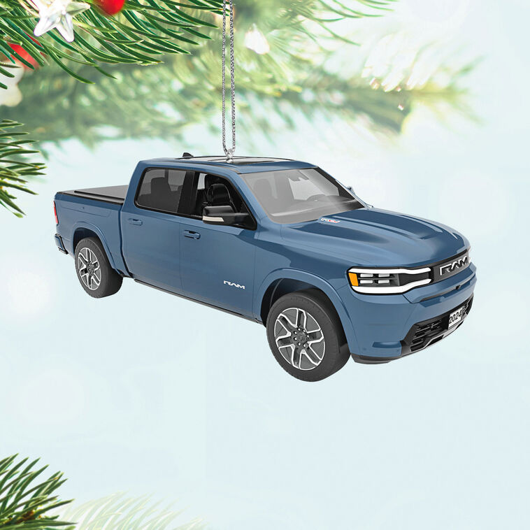 Blue Hallmark Keepsake metal ornament of 2026 Ram 1500 REV truck with detailed design, perfect for Christmas tree decorating.