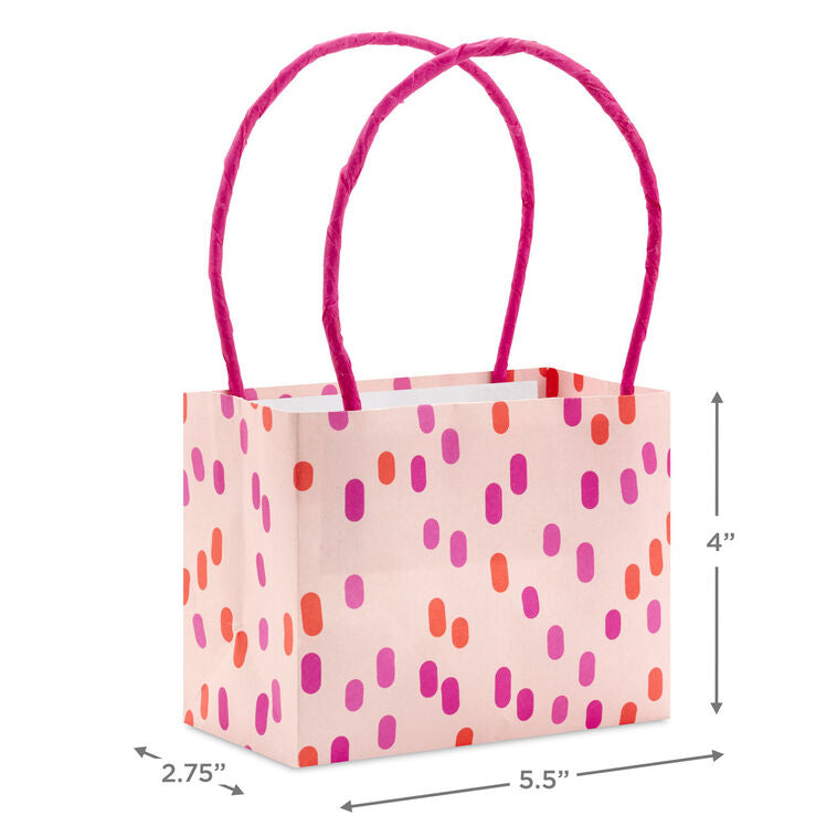 Assorted mini horizontal gift bags with pink stripes, polka dots, squiggles, and multicolor daisies, pink handles, Hallmark
