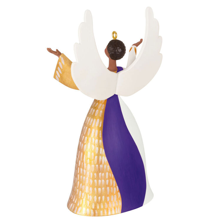 Angel ornament in gold, white, and purple gown with raised hands and detailed wings, a radiant Hallmark Keepsake holiday symbol of faith.