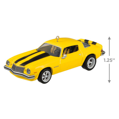 Yellow and black 1976 Chevrolet Camaro ornament from Transformers with turning wheels, representing Bumblebee in Earth vehicle disguise.