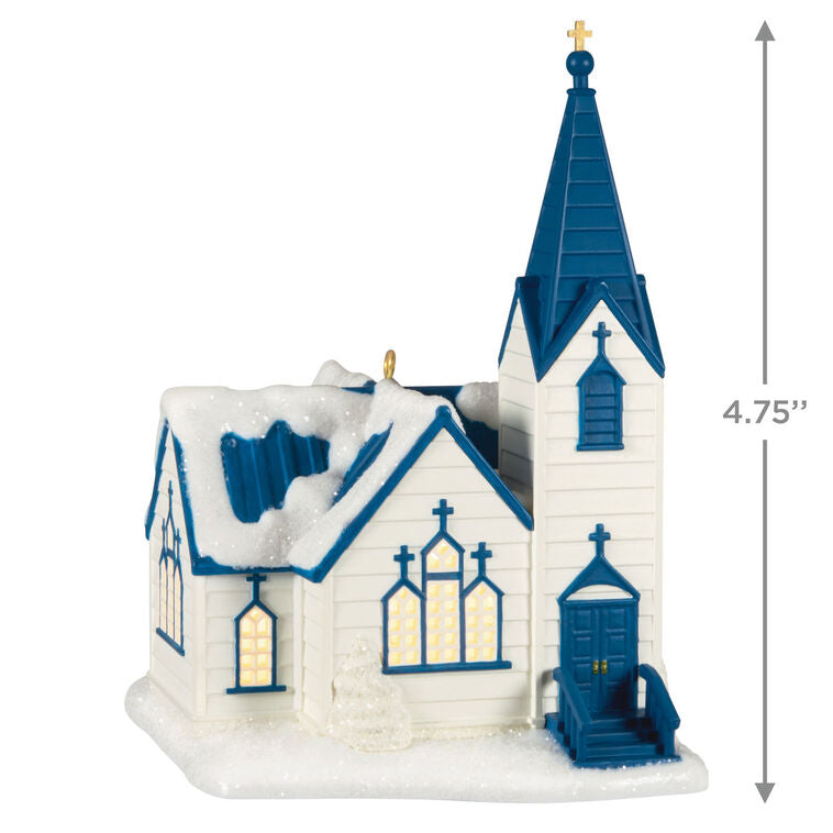 White church ornament with blue roof, steeple, and glowing windows, designed to light up with miniature Christmas light string.