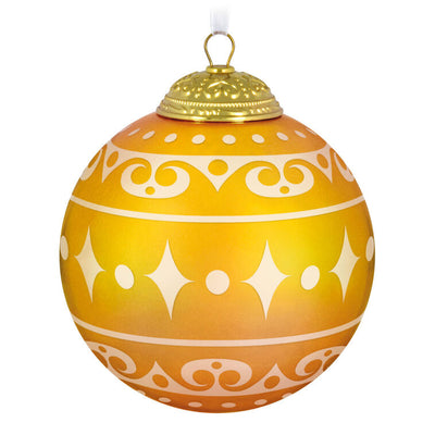 Hallmark Keepsake Christmas Commemorative 2025 ornament—yellow frosted glass ball with elegant gold scroll design, embossed metal cap, and “2025
