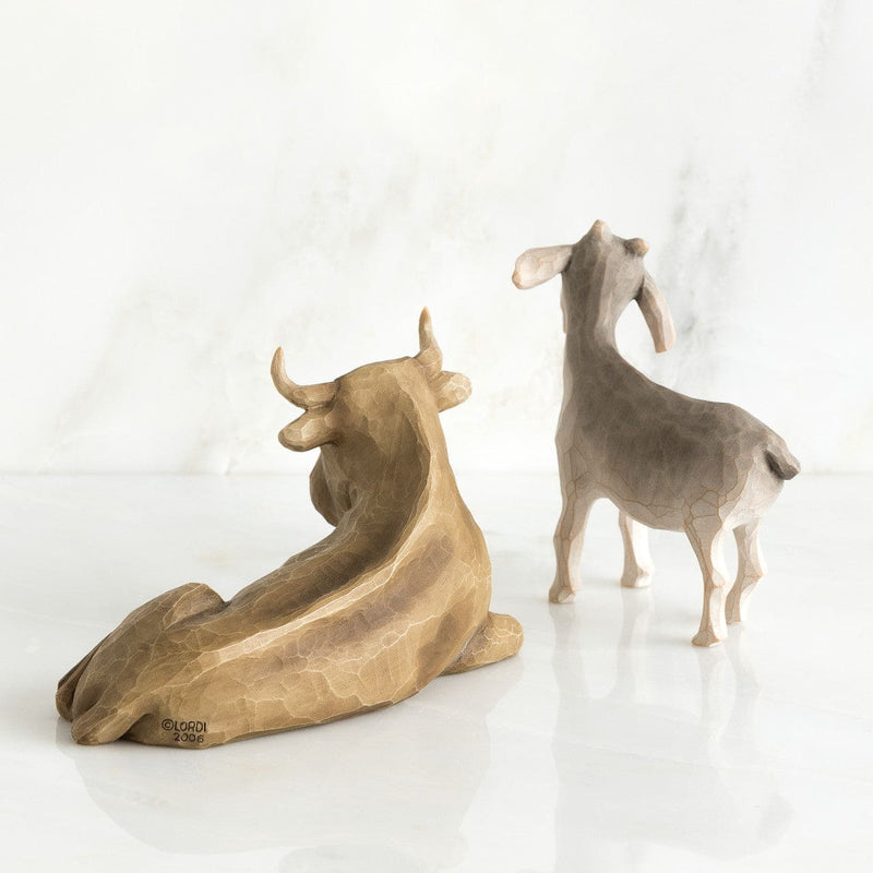 Willow Tree Ox and Goat figurines by Susan Lordi in neutral tones, part of nativity collection.