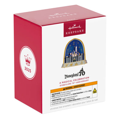 Disneyland 70th Anniversary ornament featuring Sleeping Beauty Castle, fireworks display, and shimmering lights in gold frame arch