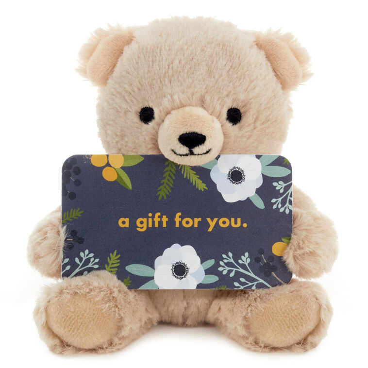Smiling plush teddy bear with open arms and wire holders for a gift card or small greeting card.


