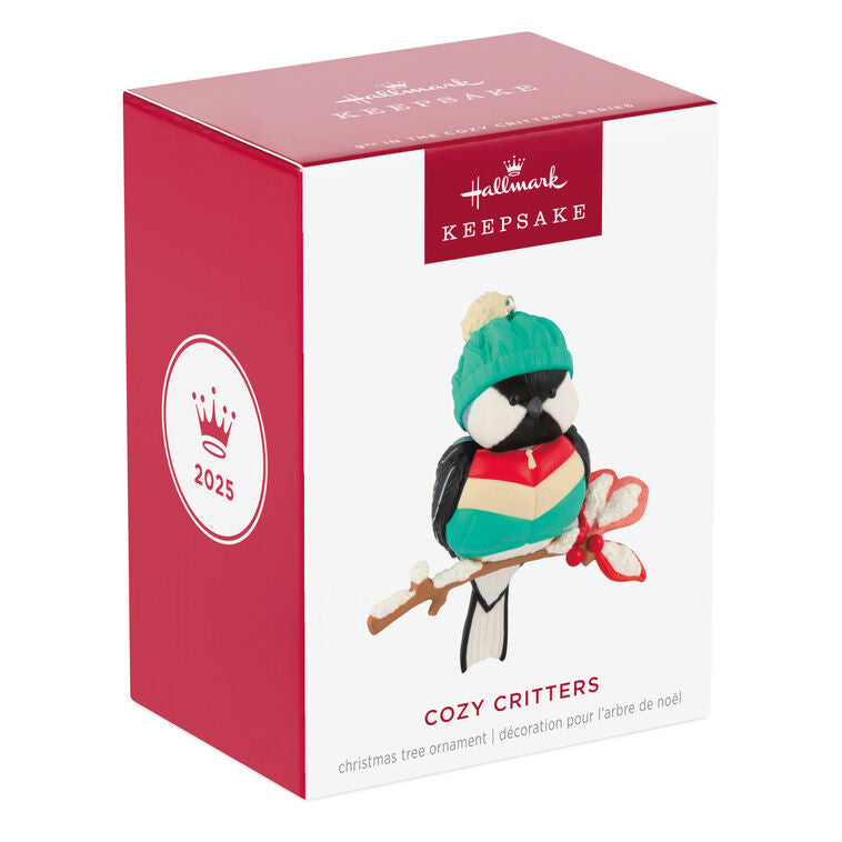 Hallmark Keepsake Cozy Critters ornament—black-capped chickadee in teal stocking hat and striped vest perched on holly branch with glittery snow