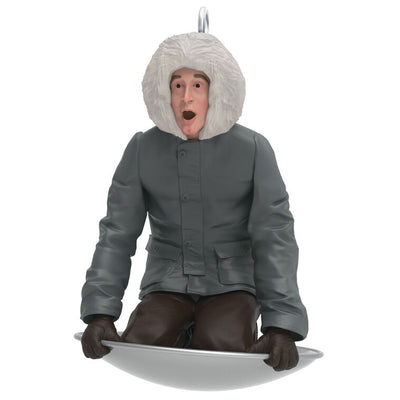 Hallmark Keepsake Mini National Lampoon’s Christmas Vacation Sledding Clark ornament—Clark in parka on saucer sled, startled expression, snowy hill