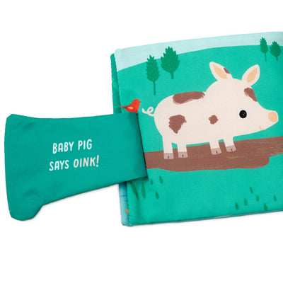 Farm-themed touch-and-feel baby book with soft fabric pages featuring baby duck, pig, horse, and cow illustrations.