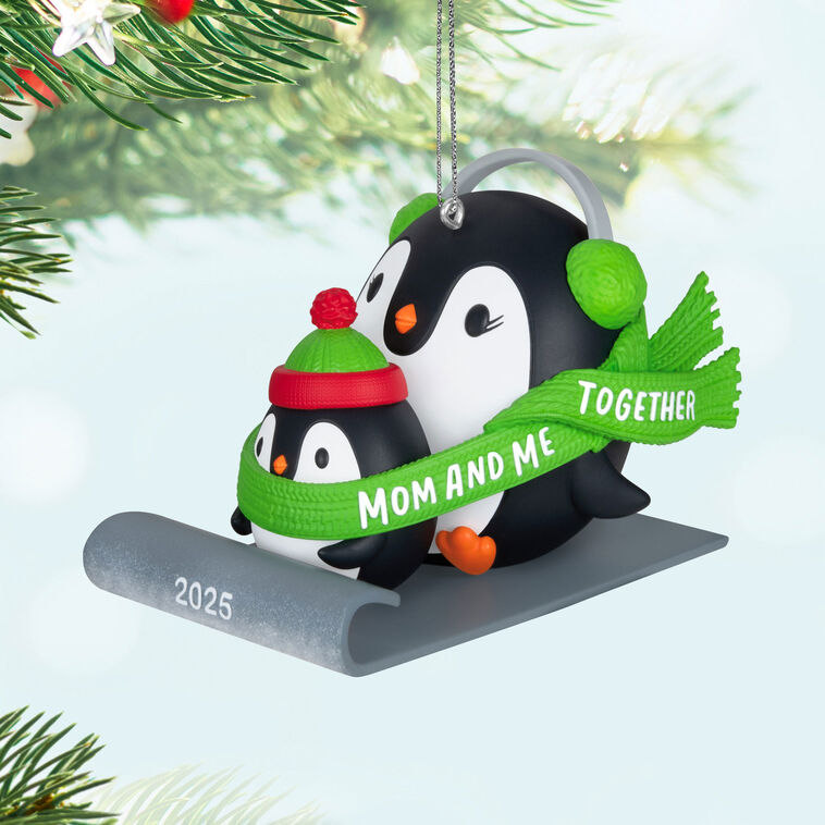 2025 Christmas ornament of mom and child penguins sledding together, green scarf with sweet message, festive holiday decor

