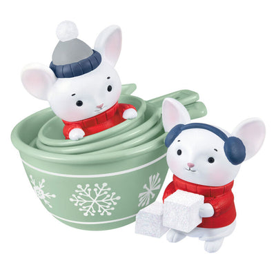 Christmas ornament with two mice in red sweaters and green measuring cups decorated with snowflakes, festive baking theme

