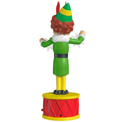 Buddy the Elf ornament with light and sound, standing on red base in green costume with snowflakes, inspired by the movie “Elf”