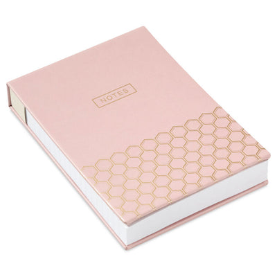 Pastel pink faux leather list pad with gold foil honeycomb design and lined, perforated pages.
