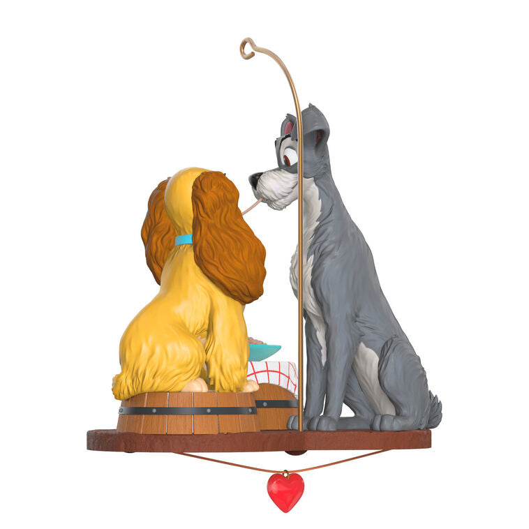 Lady and the Tramp 70th anniversary ornament featuring the Cocker Spaniel and stray dog sharing a spaghetti supper.

