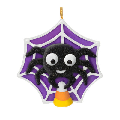 Mini Halloween spider ornament holding candy corn in sparkly web, perfect for tabletop tree display