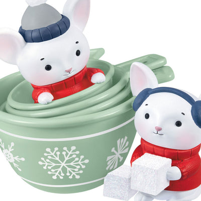 Christmas ornament with two mice in red sweaters and green measuring cups decorated with snowflakes, festive baking theme

