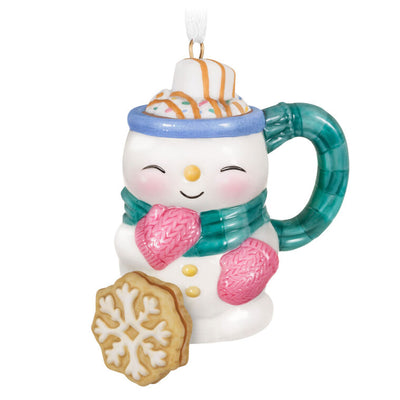 Porcelain ornament shaped like a snowman mug with scarf, pink mittens, marshmallow, caramel drizzle, and snowflake cookie, Hallmark Cup of Cozy series

