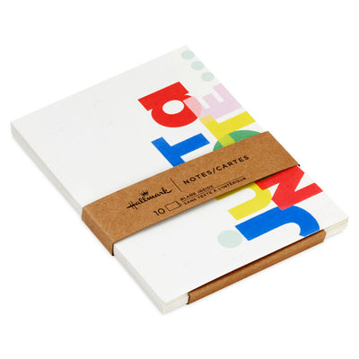 White note cards with playful block-style multicolor “Just a Note” lettering, bundled in kraft paper wrap.
