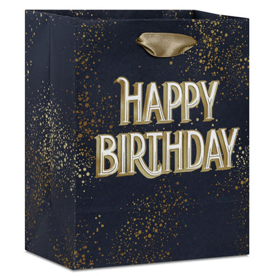Small Hallmark gift bag with “Happy Birthday” in bold white and gold foil lettering on a navy blue background with gold splatter detail.