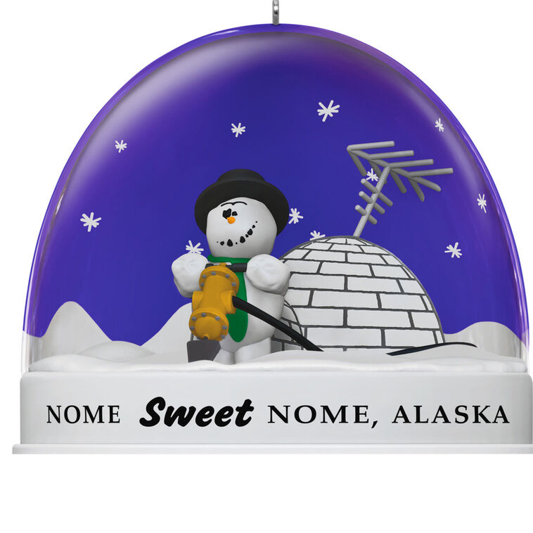 Hallmark Keepsake Knick Knack Snow Globe Escape Plan ornament with snowman inside snow globe labeled Nome, Alaska, Disney/Pixar Christmas decoration.