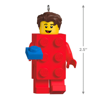 LEGO minifigure ornament with red brick body and blue hand-held piece, smiling boy with brown hair.