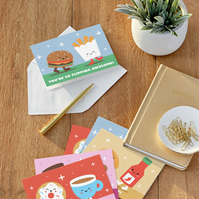 Colorful food pun note cards featuring duos like taco and hot sauce, peanut butter and jelly, and donut and coffee.
