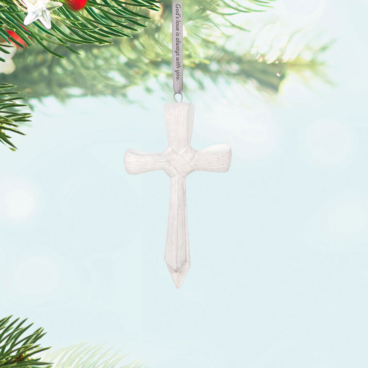 Porcelain cross ornament with palm leaf texture and ribbon inscribed with faith message, for Christmas or spiritual gift.